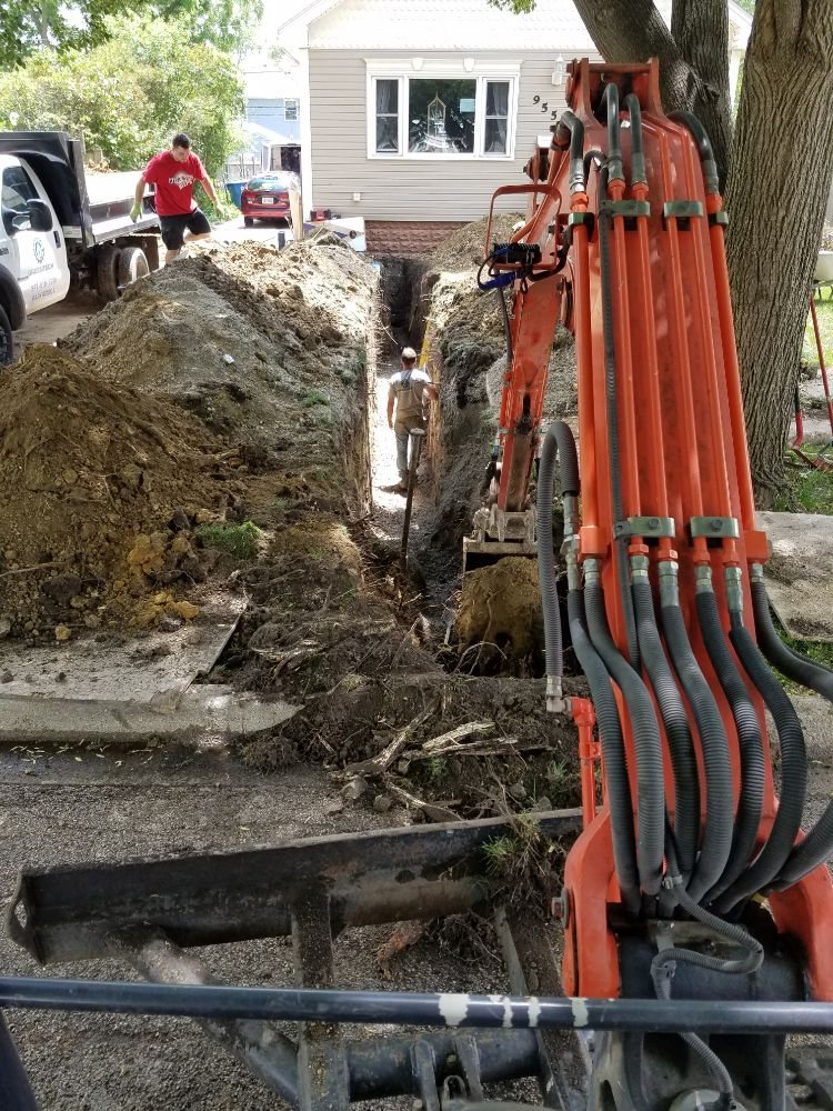 plumbers digging a trench