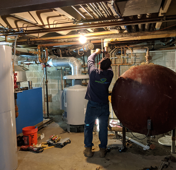 plumber working on water tank